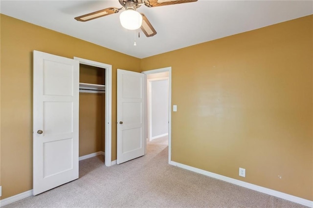 609 W Beech St, Independence, KS 67301 - unfurnished bedroom with light carpet, a closet, and ceiling fan