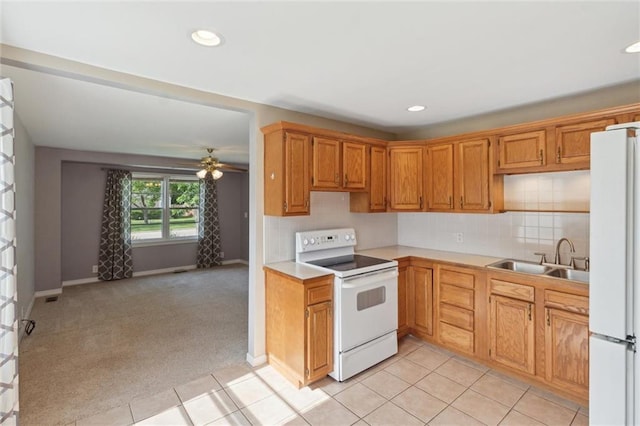 609 W Beech St, Independence, KS 67301 - kitchen with white appliances, light countertops, ceiling fan, backsplash, and recessed lighting