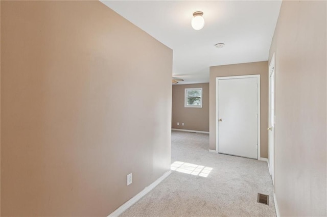 609 W Beech St, Independence, KS 67301 - corridor with light carpet and baseboards