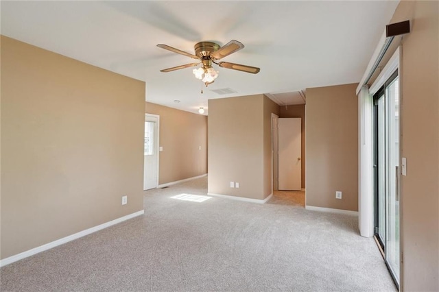 609 W Beech St, Independence, KS 67301 - unfurnished room with attic access, light carpet, and ceiling fan