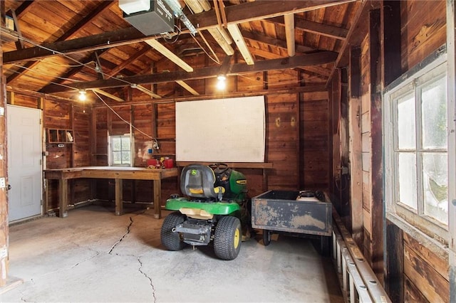 609 W Beech St, Independence, KS 67301 - garage featuring wood walls and wooden ceiling