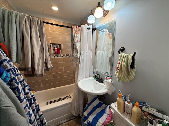 6212 Hadley St, Mission, KS 66202 - bathroom featuring shower / tub combo with curtain and recessed lighting