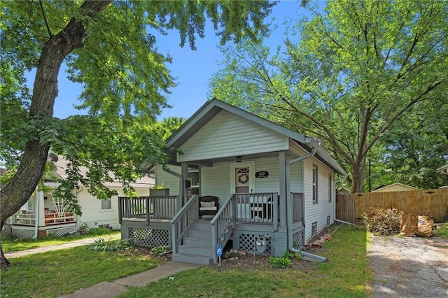 707 W 75th Ter, Kansas City, MO 64114 - view of front of home featuring covered porch
