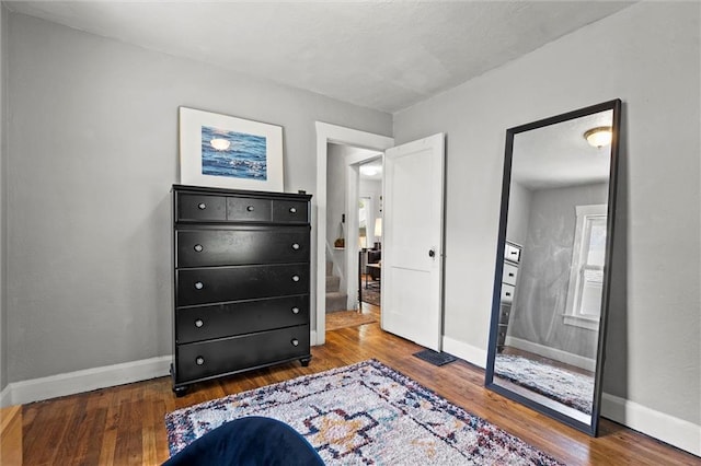 707 W 75th Ter, Kansas City, MO 64114 - bedroom with wood finished floors and baseboards