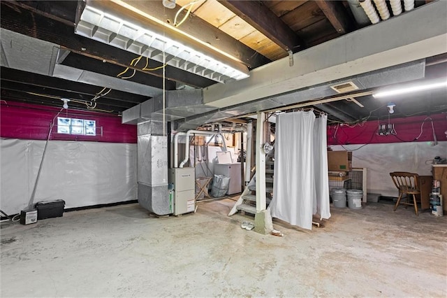 707 W 75th Ter, Kansas City, MO 64114 - below grade area with washer / clothes dryer, heating unit, and stairs