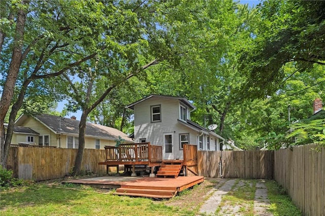 707 W 75th Ter, Kansas City, MO 64114 - back of property with a fenced backyard and a deck