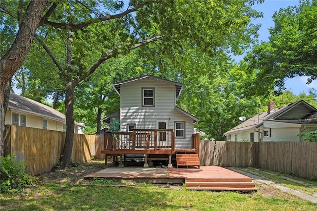 707 W 75th Ter, Kansas City, MO 64114 - back of house featuring a fenced backyard and a wooden deck