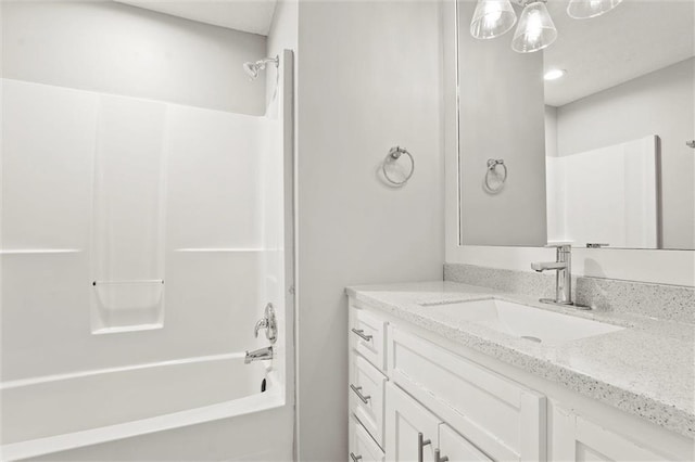 1108 W Pleasant Dr, Raymore, MO 64083 - full bath featuring vanity and bathtub / shower combination