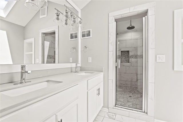 1108 W Pleasant Dr, Raymore, MO 64083 - bathroom featuring marble finish flooring, a shower stall, double vanity, lofted ceiling, and a skylight