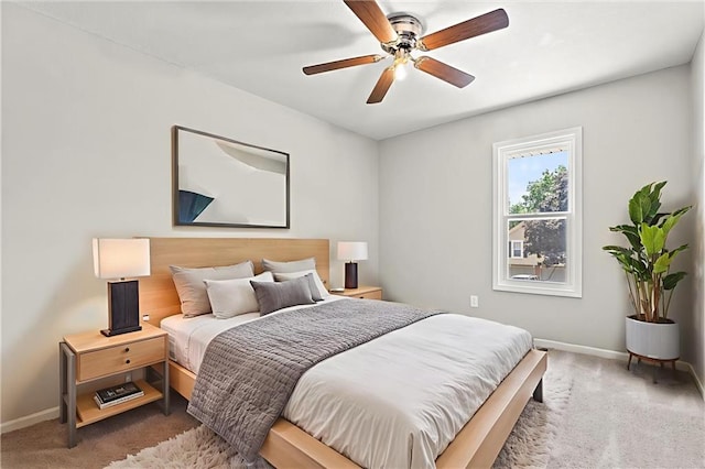 1108 W Pleasant Dr, Raymore, MO 64083 - bedroom with carpet floors and ceiling fan