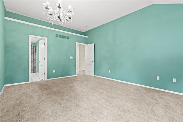 1002 W Howard Pl, Louisburg, KS 66053 - unfurnished bedroom featuring a chandelier, carpet, and ensuite bath