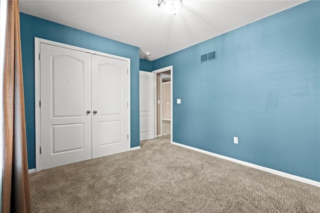 1002 W Howard Pl, Louisburg, KS 66053 - unfurnished bedroom featuring carpet floors and a closet