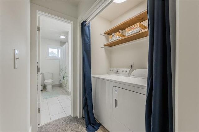 6613 E 123rd Ter, Grandview, MO 64030 - washroom with washer and clothes dryer, light tile patterned floors, and light carpet