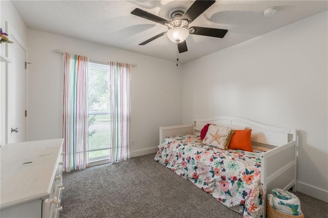 6613 E 123rd Ter, Grandview, MO 64030 - bedroom featuring carpet floors, ceiling fan, and a textured ceiling