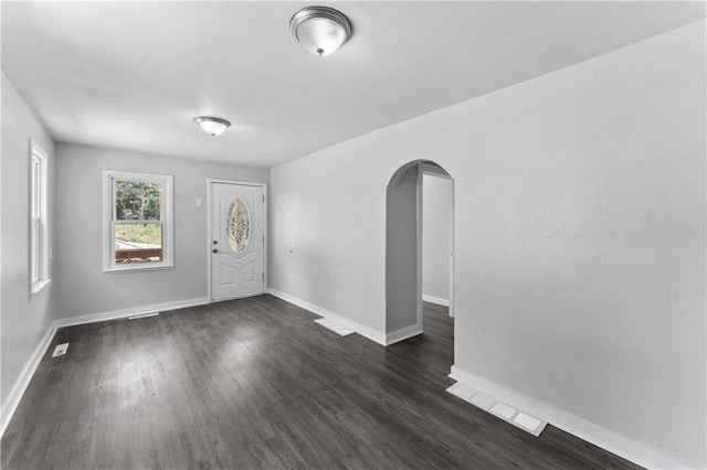 1205 E Parker Ave, Independence, MO 64050 - foyer entrance with arched walkways and dark wood finished floors