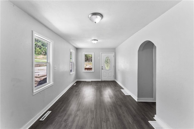 1205 E Parker Ave, Independence, MO 64050 - entryway featuring arched walkways and dark wood-type flooring