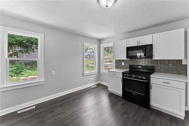 1205 E Parker Ave, Independence, MO 64050 - kitchen featuring black appliances, white cabinetry, light countertops, backsplash, and dark wood-type flooring