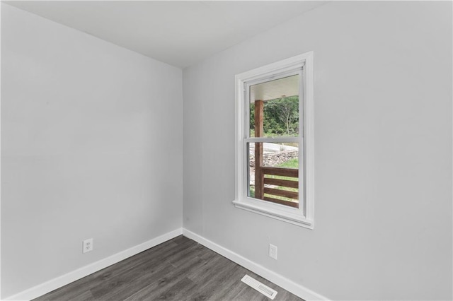 1205 E Parker Ave, Independence, MO 64050 - unfurnished room featuring baseboards and dark wood-type flooring