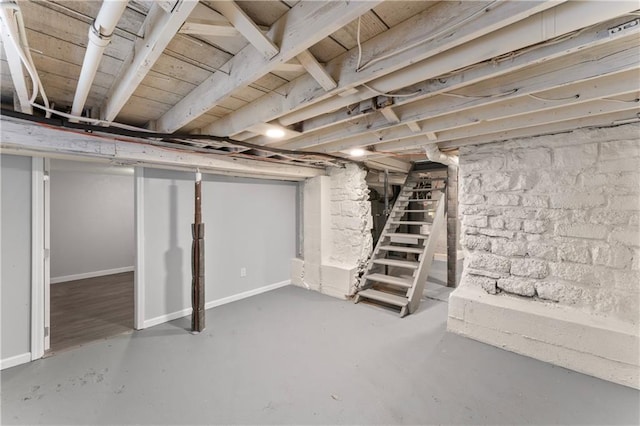 1205 E Parker Ave, Independence, MO 64050 - unfinished basement with stairs and baseboards