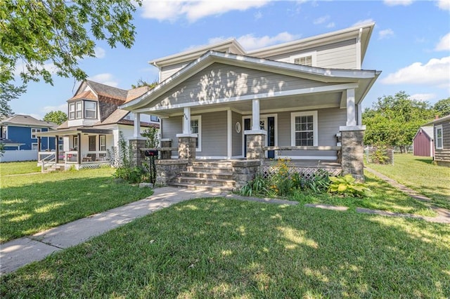 420 S Walnut St, Ottawa, KS 66067 - view of front of house featuring a porch and a front yard