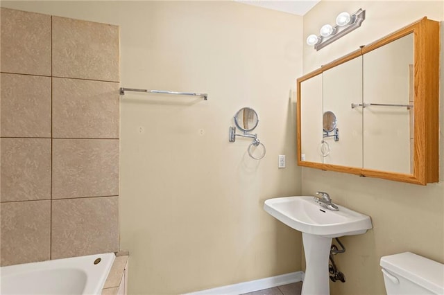 420 S Walnut St, Ottawa, KS 66067 - bathroom with toilet and baseboards