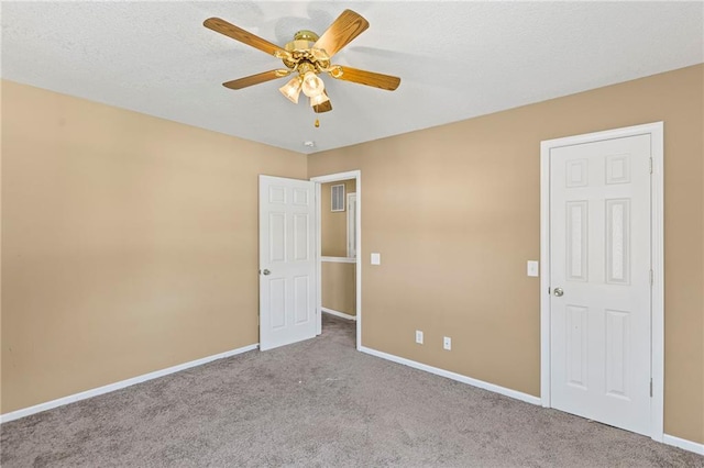 420 S Walnut St, Ottawa, KS 66067 - unfurnished bedroom featuring carpet and ceiling fan