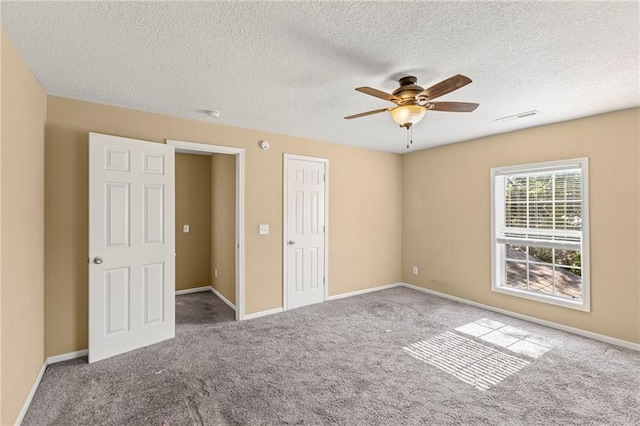420 S Walnut St, Ottawa, KS 66067 - unfurnished bedroom with carpet, a textured ceiling, and ceiling fan