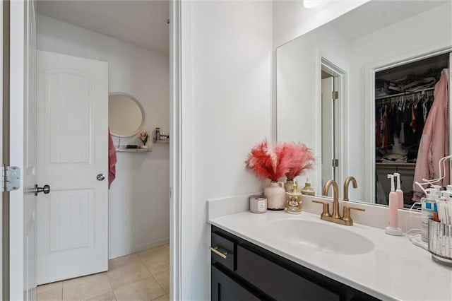 24328 W 58th Ter, Shawnee, KS 66226 - bathroom featuring vanity, tile patterned floors, and a walk in closet