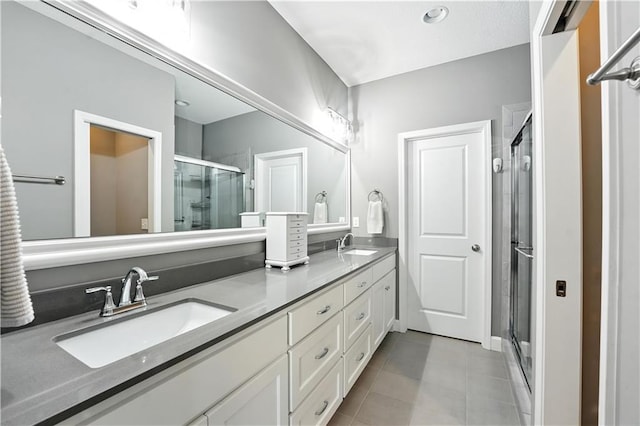 704 E 110th Ter, Kansas City, MO 64131 - full bath featuring a stall shower, double vanity, and tile patterned flooring