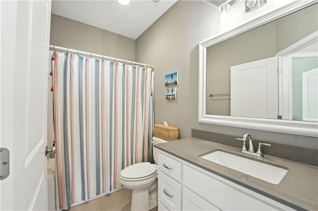 704 E 110th Ter, Kansas City, MO 64131 - bathroom with vanity, shower / tub combo with curtain, and tile patterned flooring