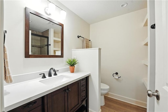 704 E 110th Ter, Kansas City, MO 64131 - full bathroom with vanity, wood finished floors, and an enclosed shower