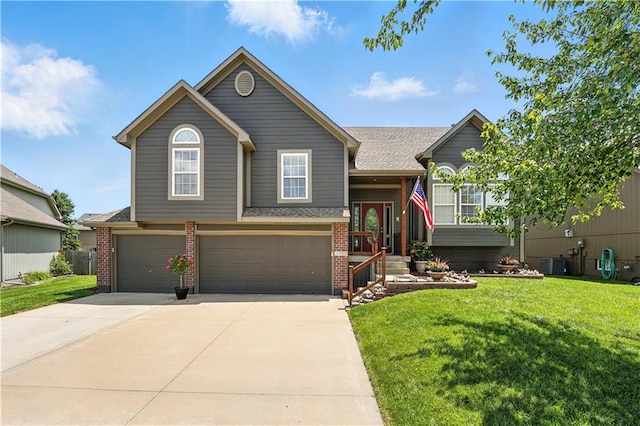 2353 SW Switchback Ct, Lees Summit, MO 64082 - view of front of property with brick siding, an attached garage, a front lawn, and concrete driveway