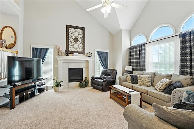 2353 SW Switchback Ct, Lees Summit, MO 64082 - living area with high vaulted ceiling, carpet floors, a ceiling fan, and a tiled fireplace