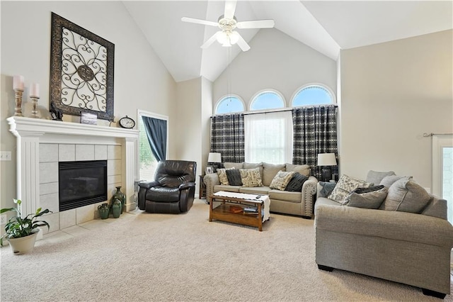 2353 SW Switchback Ct, Lees Summit, MO 64082 - living area with high vaulted ceiling, carpet floors, ceiling fan, healthy amount of natural light, and a fireplace