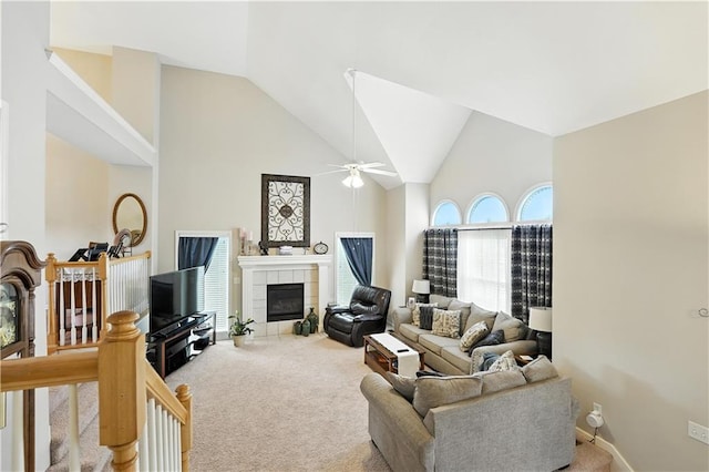 2353 SW Switchback Ct, Lees Summit, MO 64082 - carpeted living area featuring ceiling fan, high vaulted ceiling, and a tile fireplace