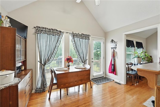 2353 SW Switchback Ct, Lees Summit, MO 64082 - dining room featuring light wood-style flooring, high vaulted ceiling, and a ceiling fan