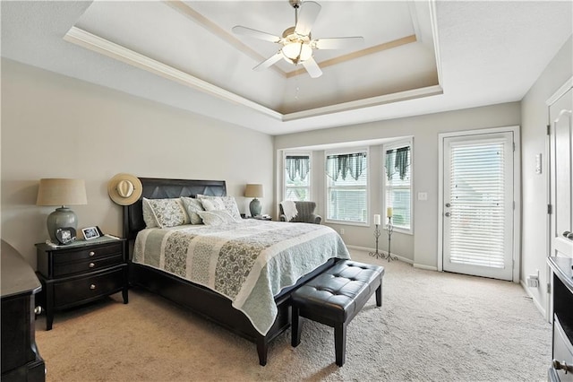 2353 SW Switchback Ct, Lees Summit, MO 64082 - bedroom featuring a raised ceiling, access to outside, light carpet, ceiling fan, and crown molding