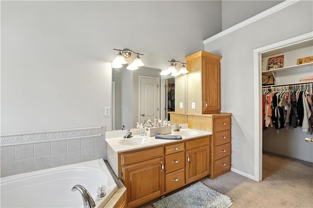 2353 SW Switchback Ct, Lees Summit, MO 64082 - bathroom featuring double vanity, a bath, and a walk in closet