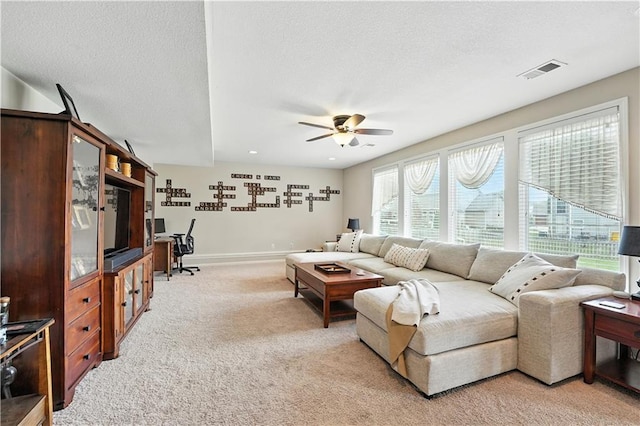 2353 SW Switchback Ct, Lees Summit, MO 64082 - living room with ceiling fan, light carpet, and a textured ceiling
