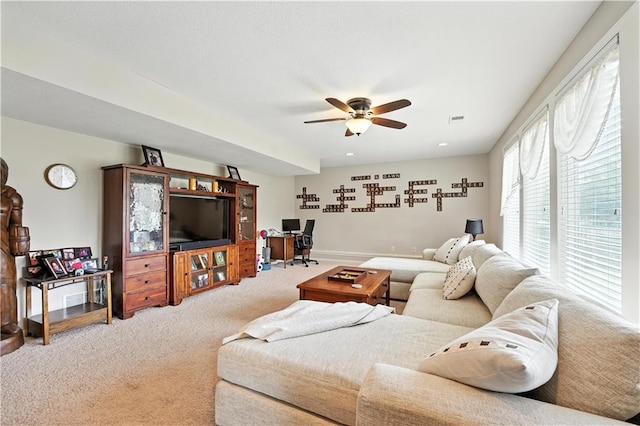 2353 SW Switchback Ct, Lees Summit, MO 64082 - living room with carpet flooring, ceiling fan, and a desk