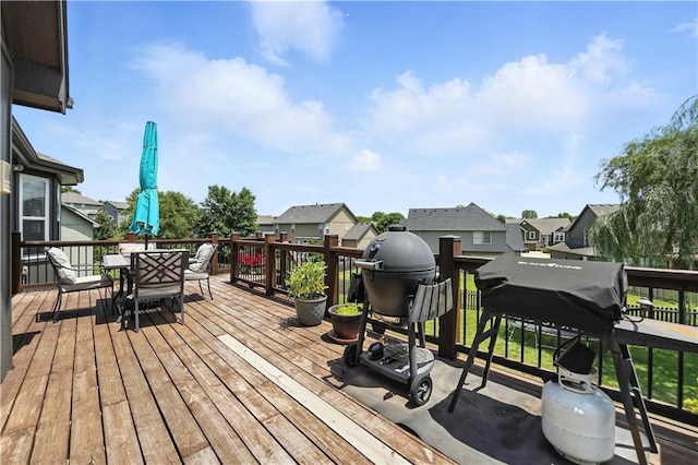 2353 SW Switchback Ct, Lees Summit, MO 64082 - deck with outdoor dining space, a residential view, and a grill