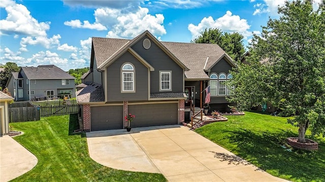 2353 SW Switchback Ct, Lees Summit, MO 64082 - view of front of home with brick siding, driveway, an attached garage, and a shingled roof