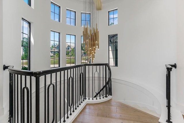 27497 W 108th St, Olathe, KS 66061 - corridor featuring a high ceiling, hardwood / wood-style floors, and an upstairs landing