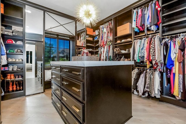 27497 W 108th St, Olathe, KS 66061 - spacious closet featuring a chandelier and light wood-style floors