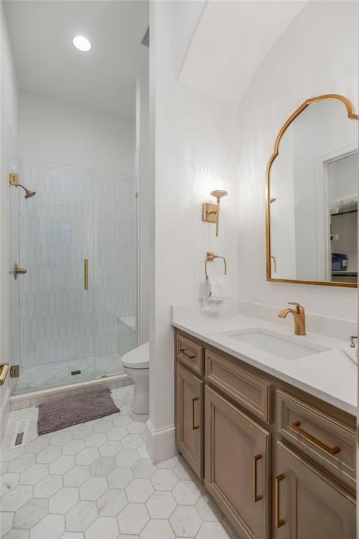 27497 W 108th St, Olathe, KS 66061 - full bathroom featuring vanity, a stall shower, tile patterned floors, and recessed lighting