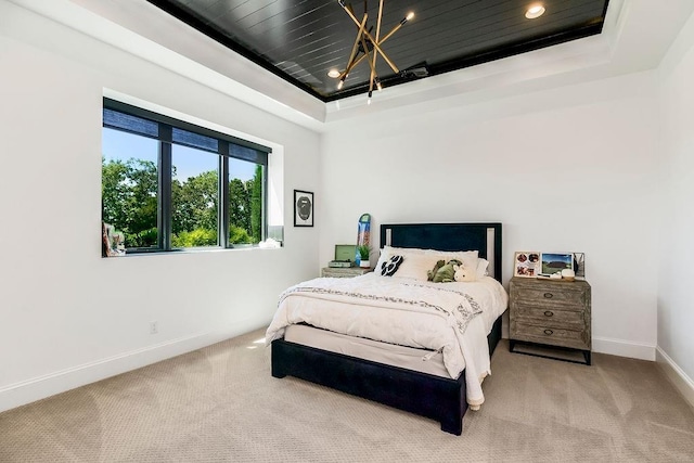27497 W 108th St, Olathe, KS 66061 - bedroom featuring a tray ceiling, carpet floors, and a chandelier