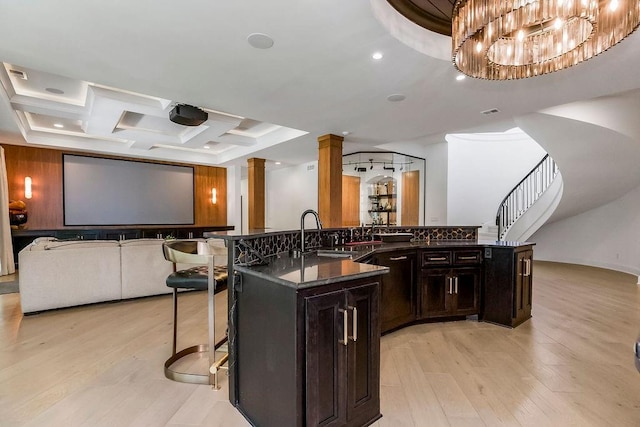 27497 W 108th St, Olathe, KS 66061 - cinema with decorative columns, light wood-style floors, coffered ceiling, and recessed lighting