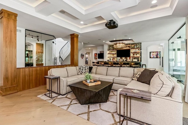 27497 W 108th St, Olathe, KS 66061 - living room featuring wood finished floors, coffered ceiling, decorative columns, wooden walls, and beamed ceiling