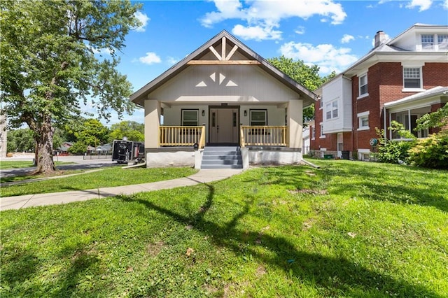 341 N 15th St, Kansas City, KS 66102 - view of front of property featuring covered porch and a front yard
