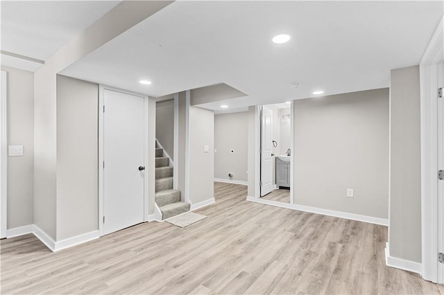 341 N 15th St, Kansas City, KS 66102 - finished below grade area with light wood-type flooring, stairway, and recessed lighting